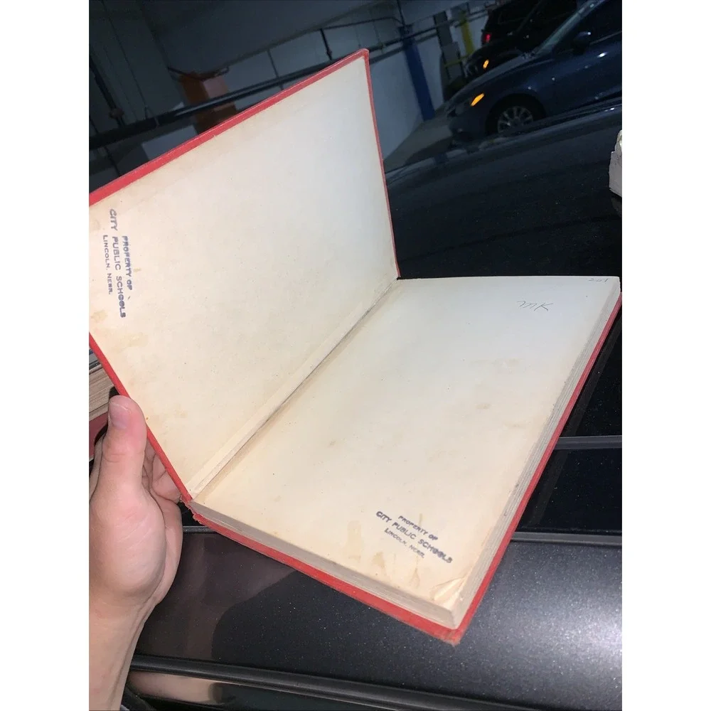 Volume 7 (H) of the vintage red and gold Britannica Junior Encyclopædia